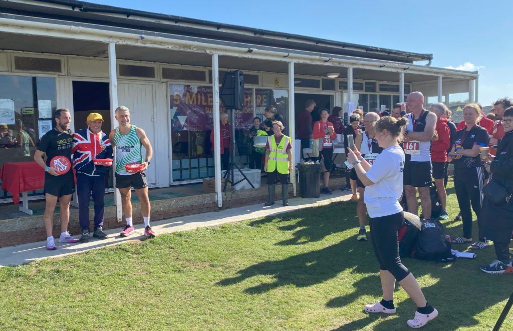 runners presentation outside a club house